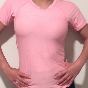 Pink athletic shirt.